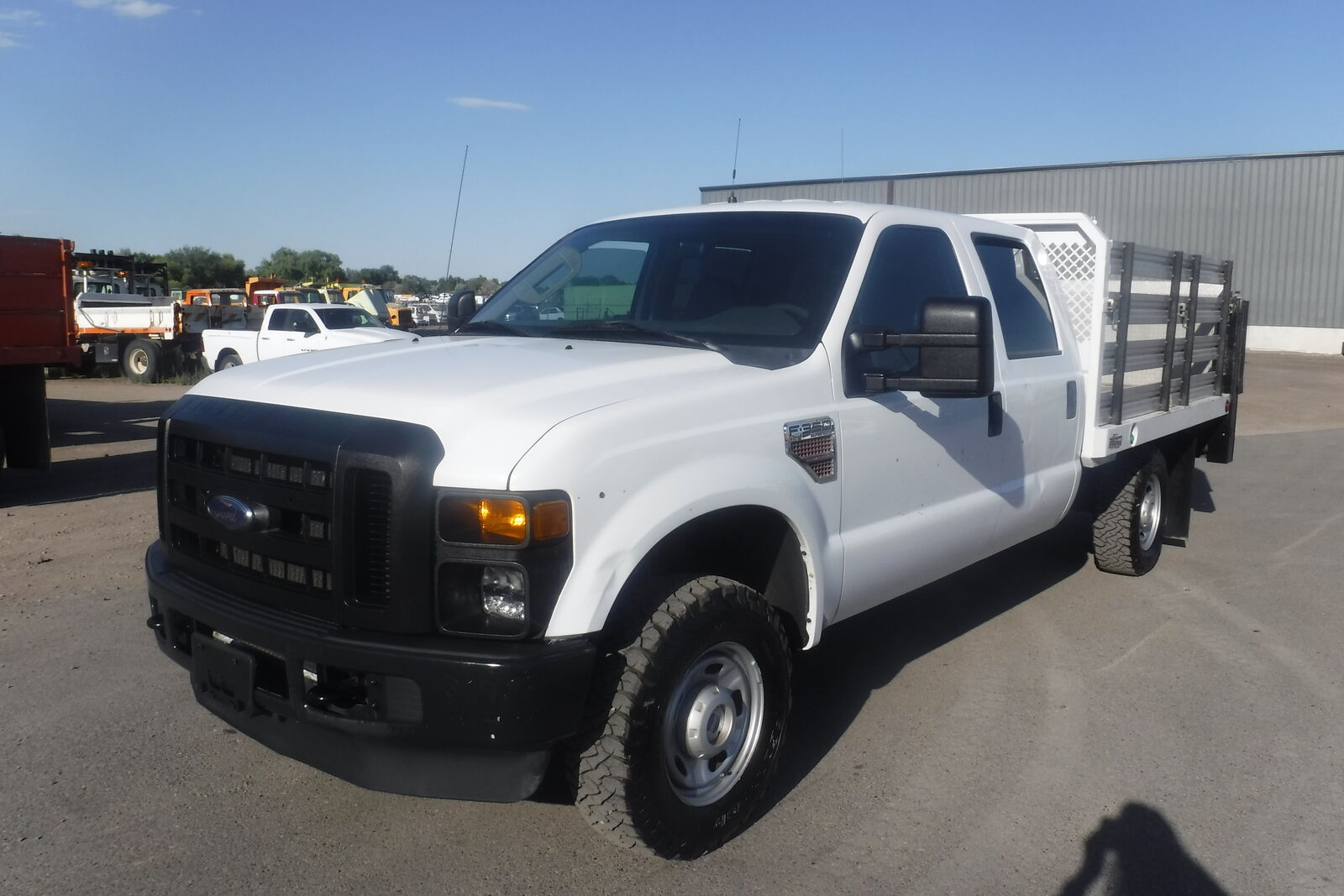 2010 Ford F350 crew cab 4X4 with 9 ft. flatbed and liftgate New Ford crate engine.