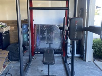 FreeMotion Squat Rack with Bench and Barbell Weight Set - Home Gym Equipment