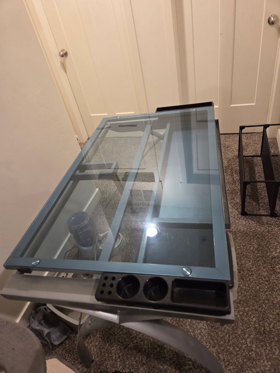 Adjustable glass top desk