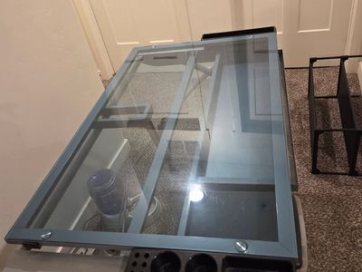 Adjustable glass top desk