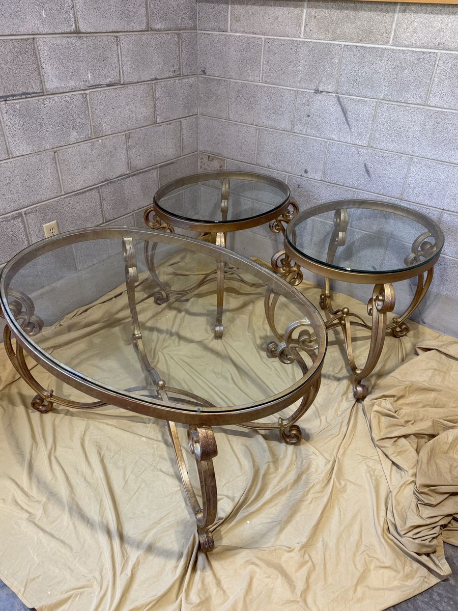 4 piece high-end gold and glass top table set.