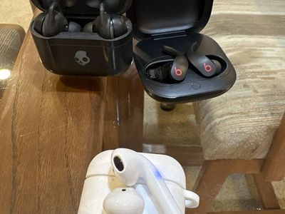 Skullcandy, Beats by Dre, and Generic Wireless Earbuds with Charging Casest