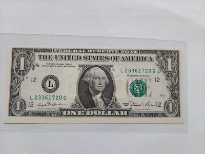 1981 One Dollar Bill L23361720G - Federal Reserve Note uncirculated, off center.