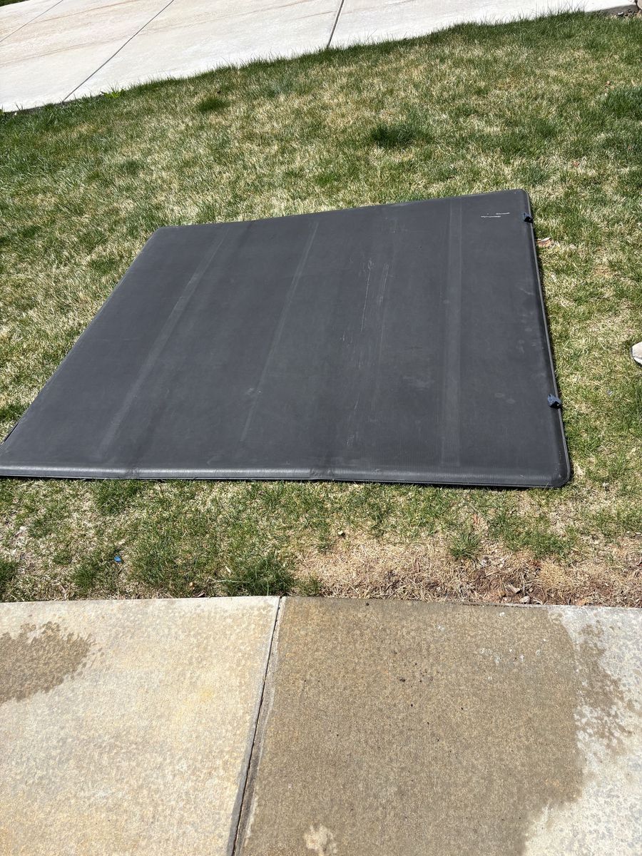 Trifold bed cover for a short bed truck