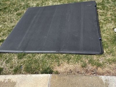 Trifold bed cover for a short bed truck