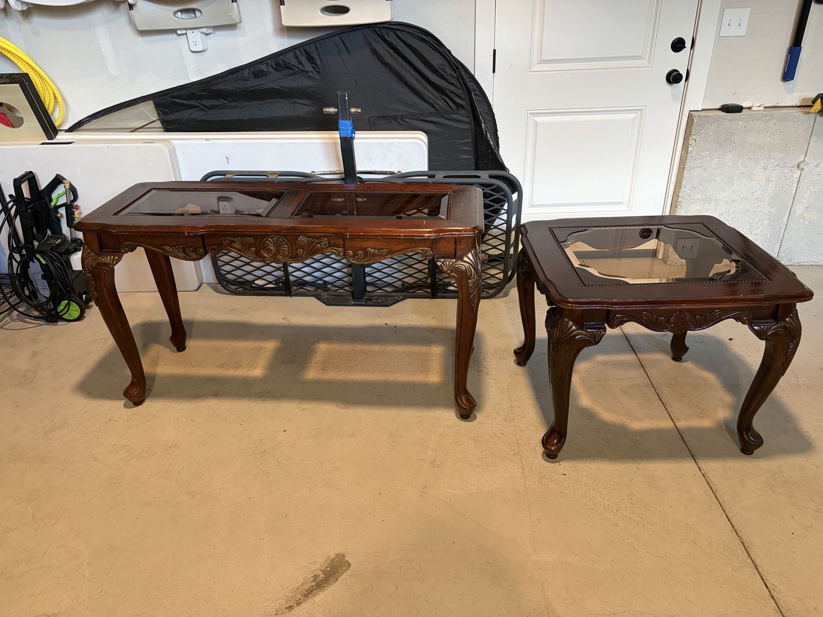 Set of vintage mahogany Chippendale style tables feature Queen Anne legs with ball and claw feet and inset glass tops.