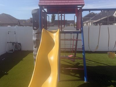 Lifetime Adventure Tower Playset - Yellow Slide, Swings, Climbing Wall, & Rock Climbing Wall