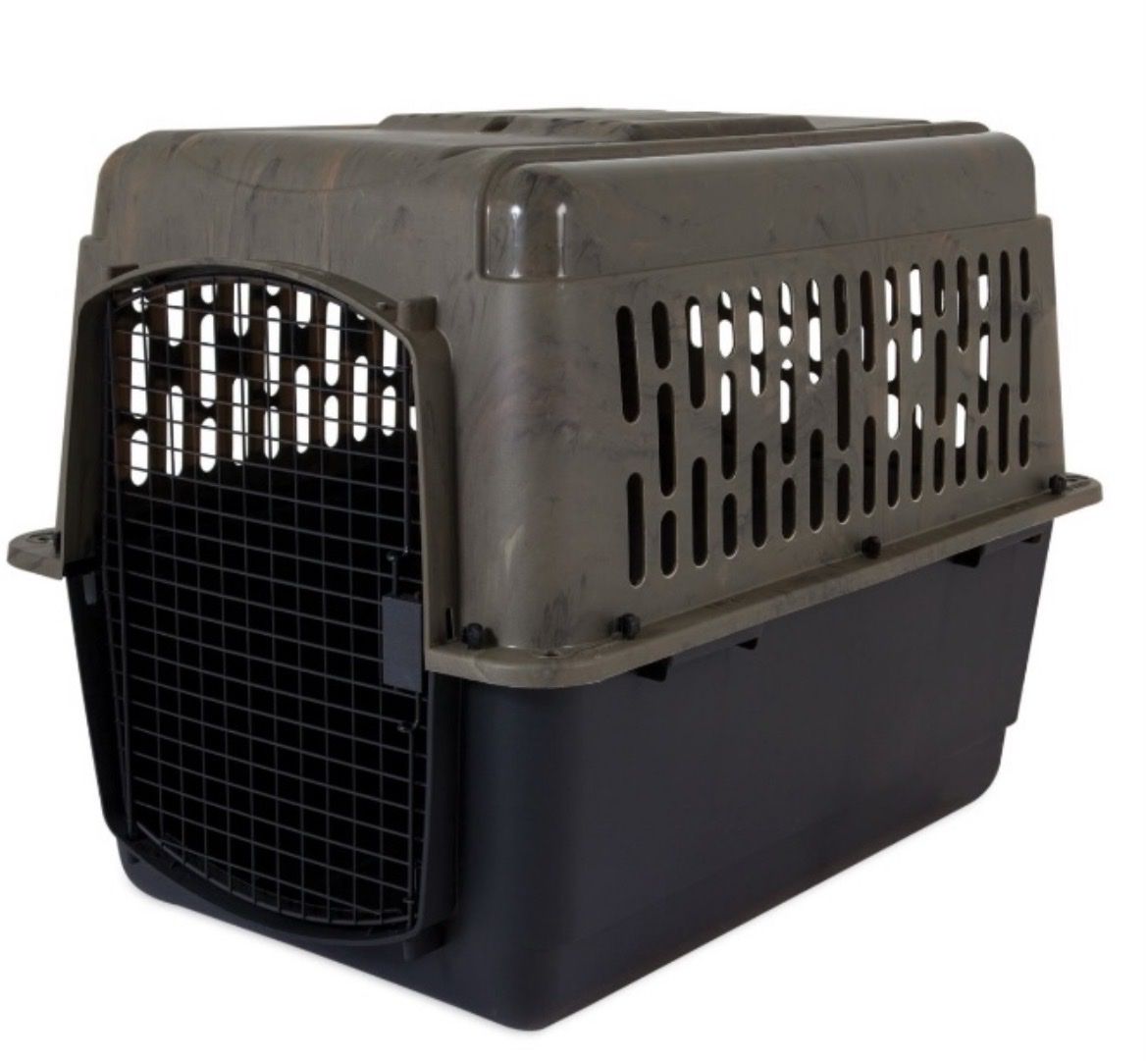 2 intermediate plastic dog crates