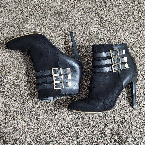 Women's size 8.5 black heels with gold buckles