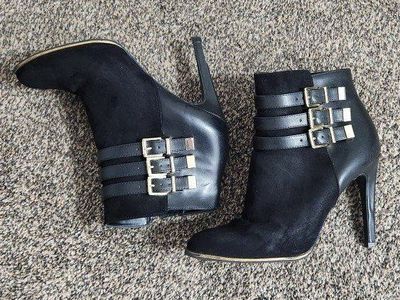 Women's size 8.5 black heels with gold buckles