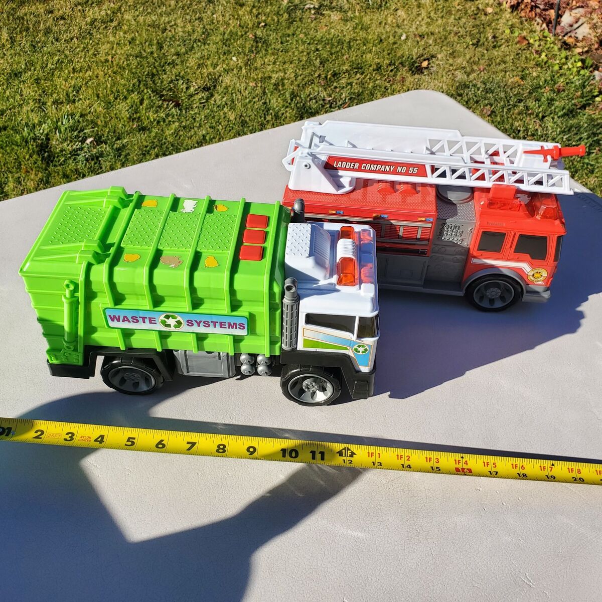 Toy garbage truck and fire truck