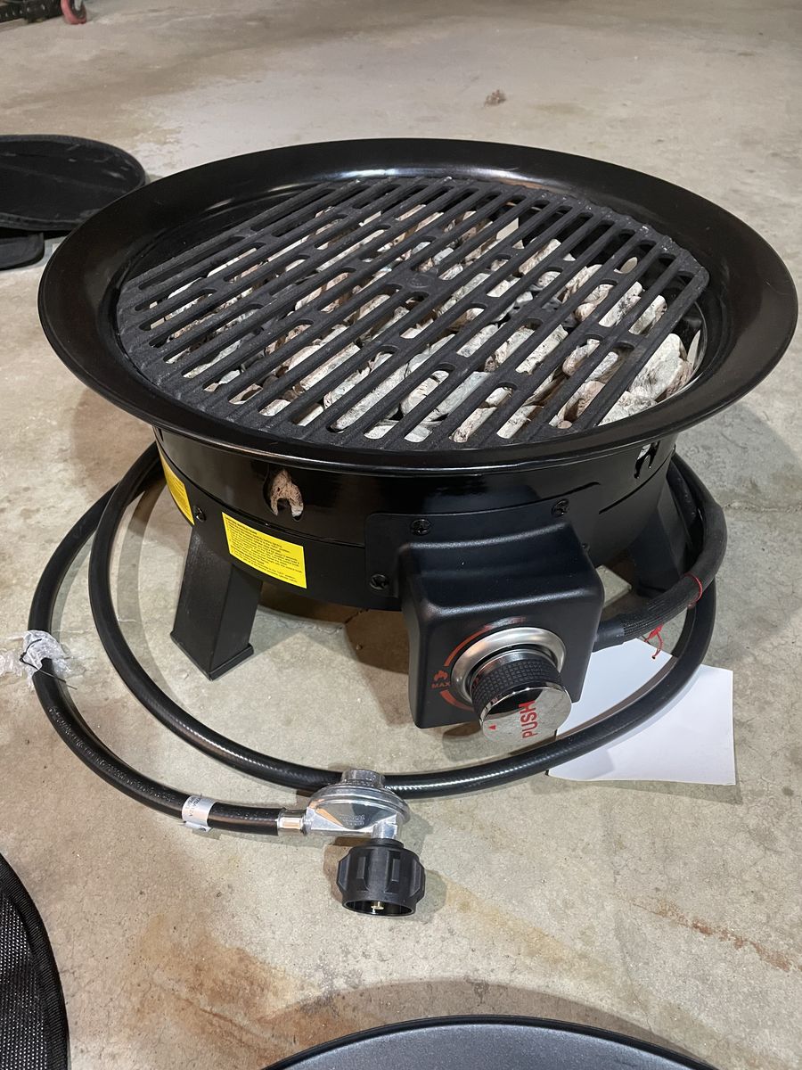 Propane fire pit with bag and mat