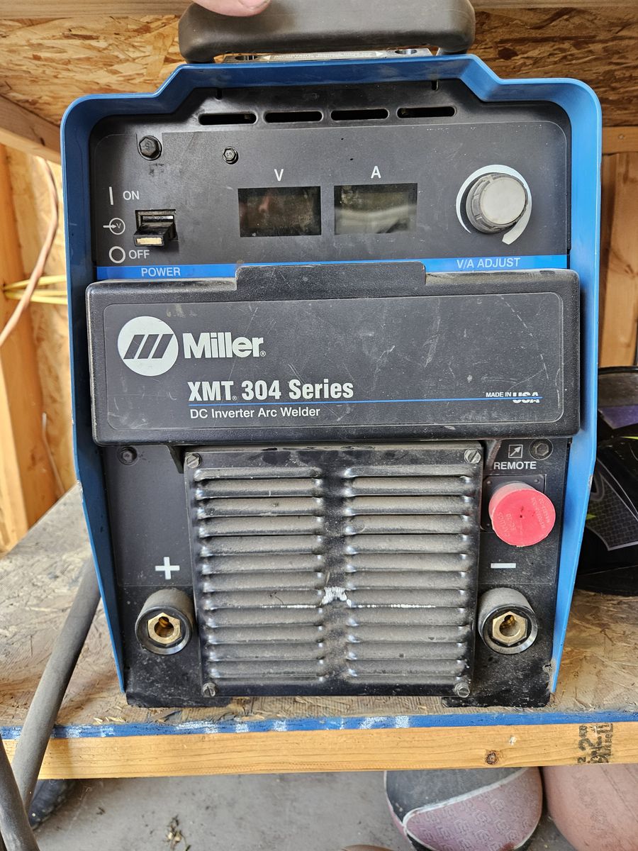 Miller XMT 304 Series Multiprocess Welder paired with a Lincoln Electric LN-25 Pro wire feeder and 300 Ib gas bottle