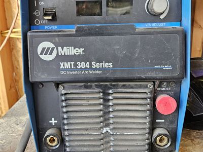 Miller XMT 304 Series Multiprocess Welder paired with a Lincoln Electric LN-25 Pro wire feeder and 300 Ib gas bottle