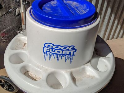 Cool Float" floating cooler, specifically a blue, round plastic cooler
