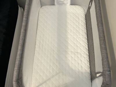 Gray Mesh Baby Bassinet with Mattress Pad and Wheels