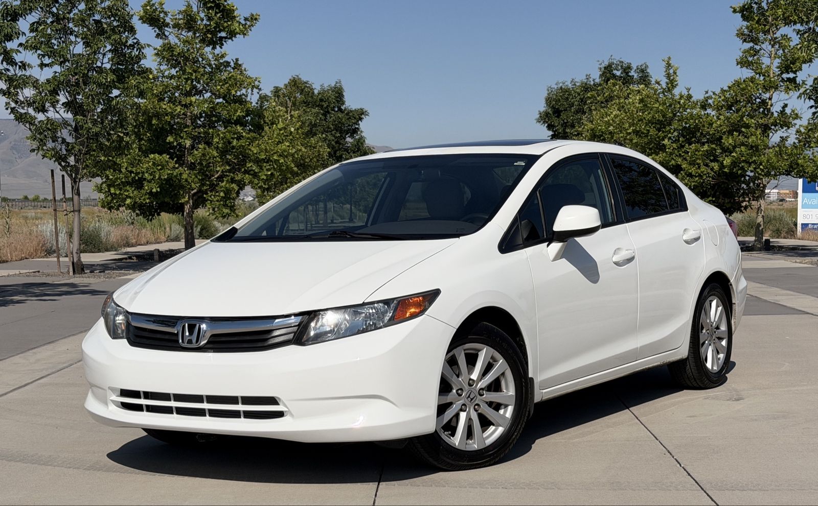 2012 Honda Civic EX-L — rebuilt & branded title, 15% below market