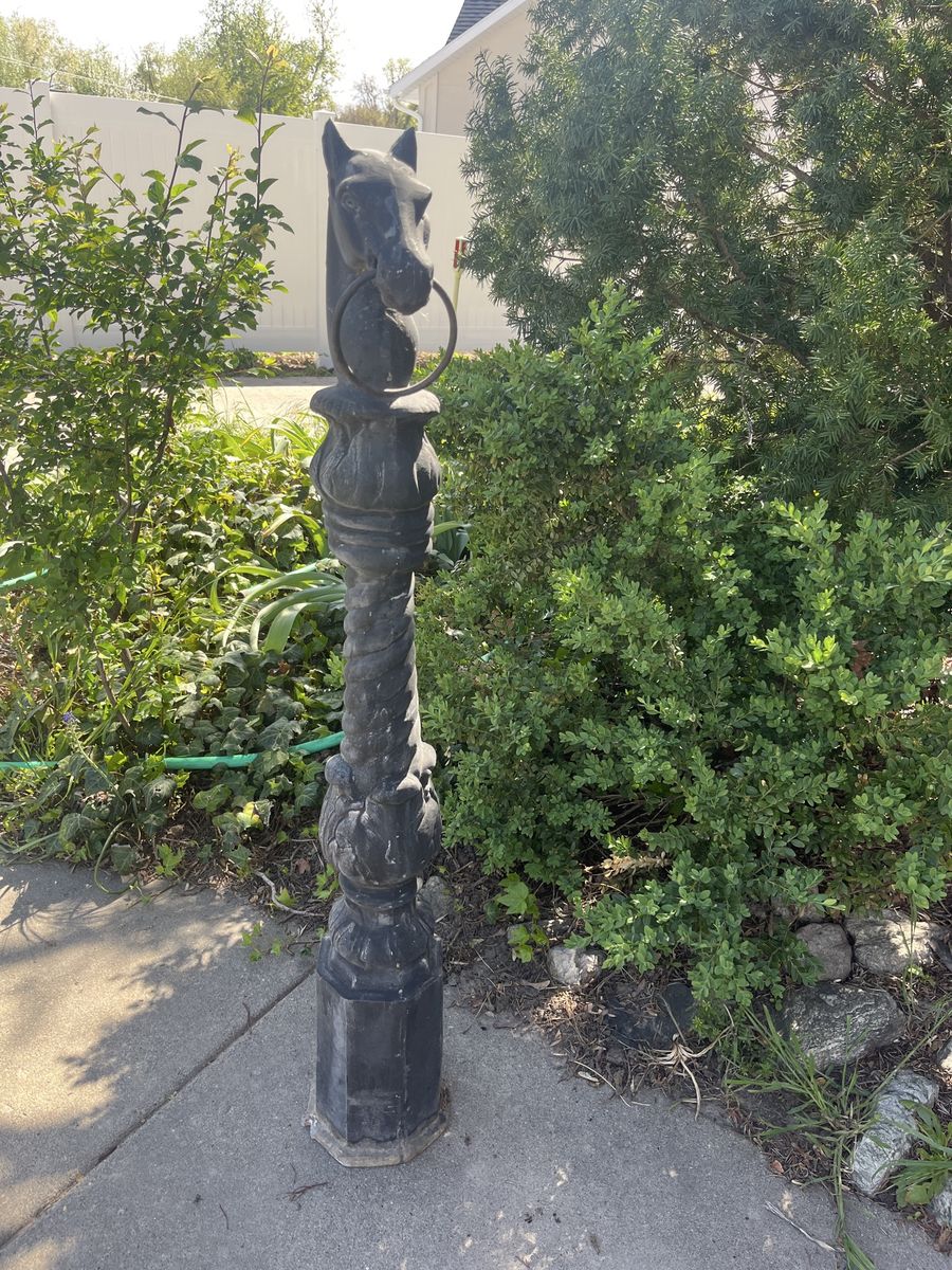 Antique horse head hitching post