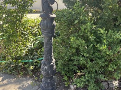 Antique horse head hitching post