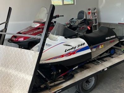Snowmobiles and trailer