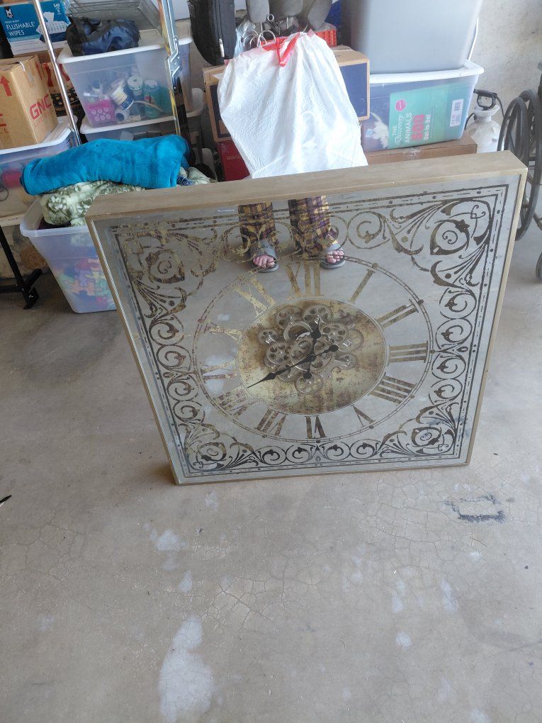 large mirrored gear clock