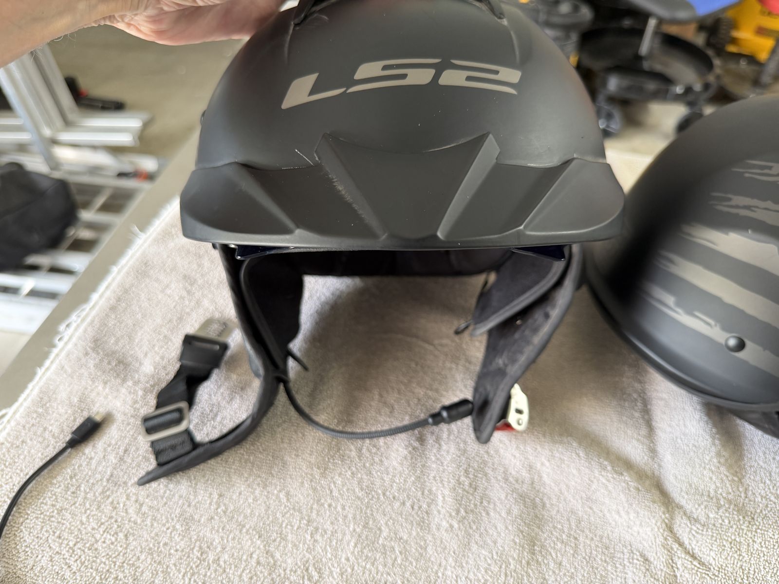 LS2 Matte Black Motorcycle Helmet with Integrated Sun Visor and Flag Graphic