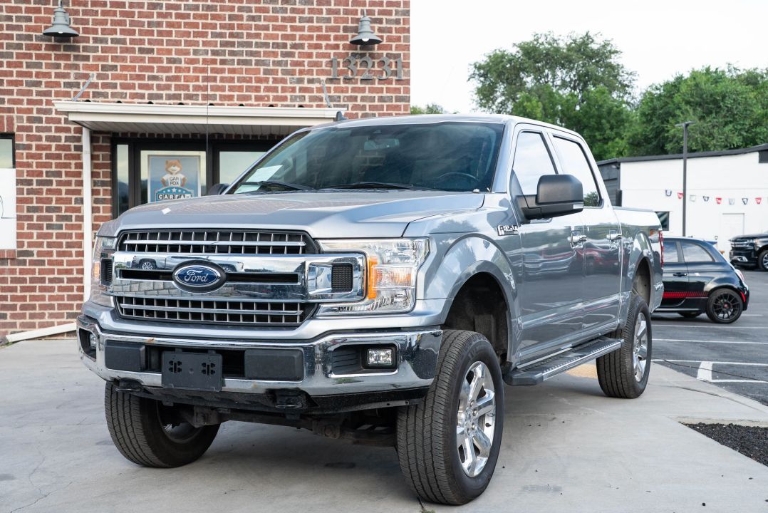 2020 Ford F-150 XLT — rebuilt & branded title, 28% below market