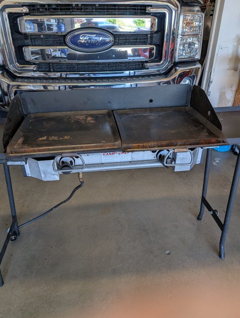 Camp Chef 2 burner stove w/bbq, griddle, and flame deflecters.