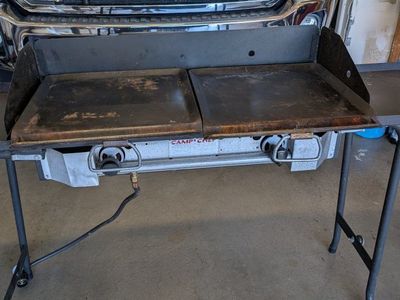 Camp Chef 2 burner stove w/bbq, griddle, and flame deflecters.