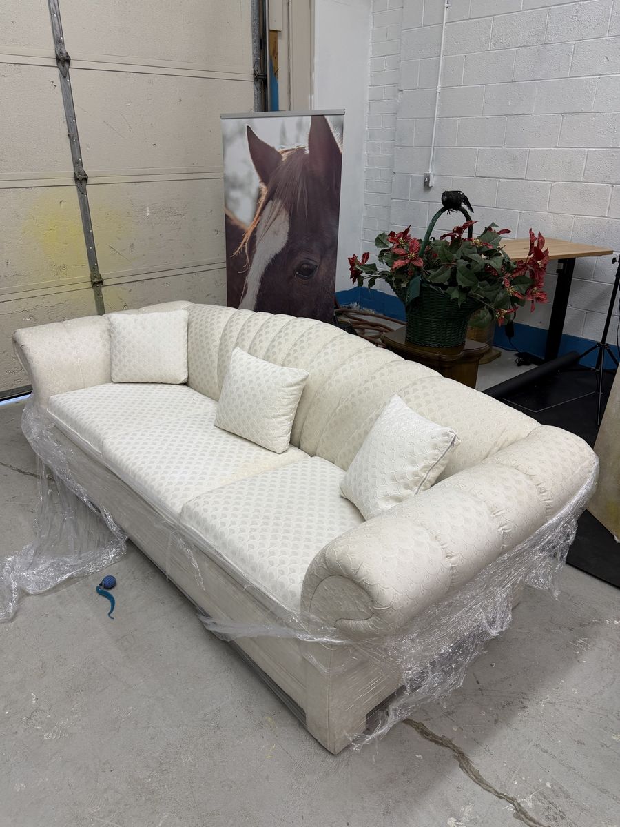 Cream Tufted Fabric Sofa with Rolled Arms and Matching Pillows