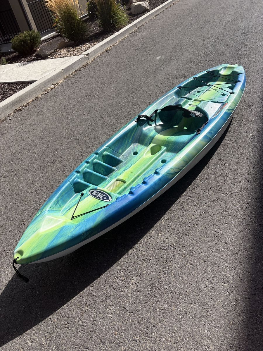 10ft green and blue Pelican Kayak with paddle (2 available/price listed for single Kayak).