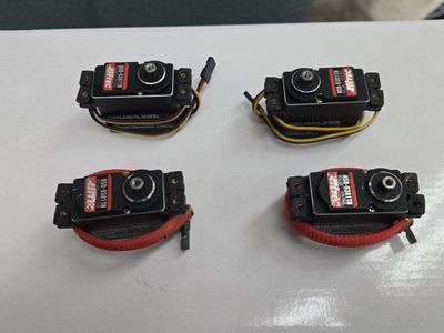 Set of 4 used Hitec HSB-9381TH Brushless Ultra Torque Titanium Gear Servos