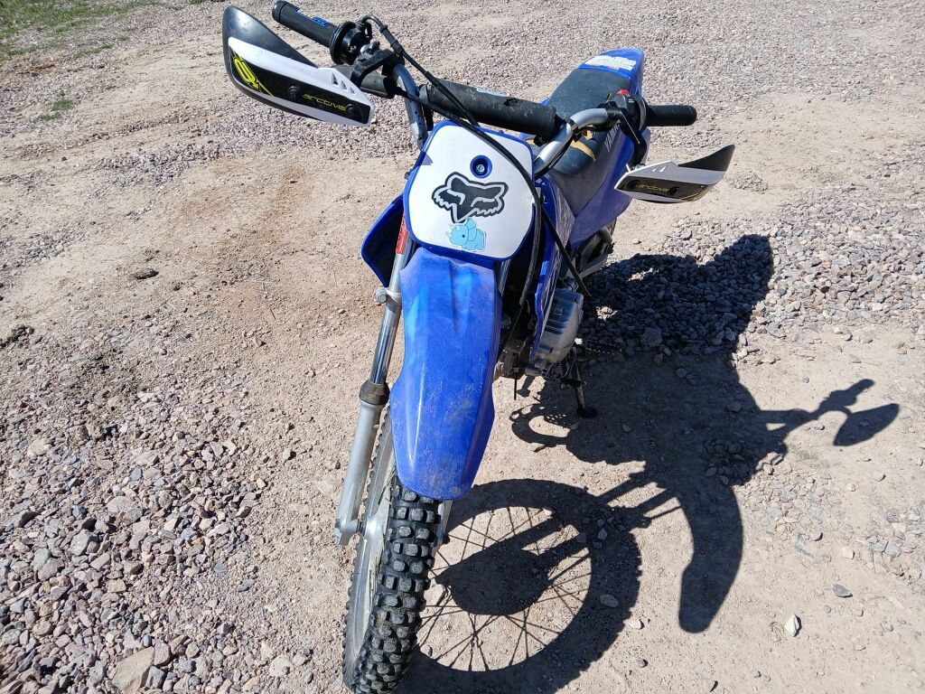 Blue Yamaha TT-R90 dirt bike