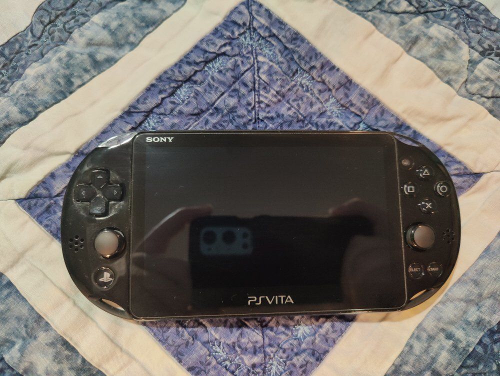 Ps Vita Slim and 64 GB proprietary storage card