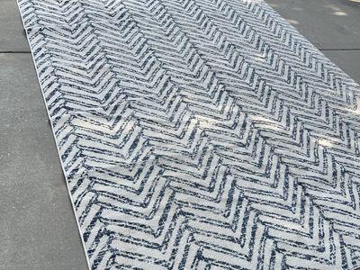 Free 9’x12’ Blue & White Geometric Rug