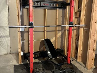 Ethos Wall-Mounted Folding Squat Rack w/ Adjustable Bench & Weights