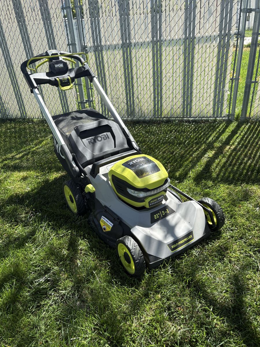 Ryobi 21" 40V HP Brushless Cordless Self-Propelled Lawn Mower with Bagger, Mulching, Side Discharge, charger and two batteries