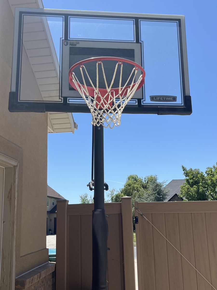 Lifetime Shatter Proof Adjustable Portable Basketball Hoop System with Red Rim