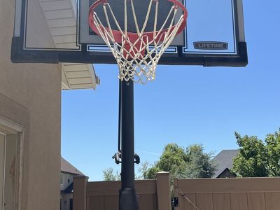 Lifetime Shatter Proof Adjustable Portable Basketball Hoop System with Red Rim