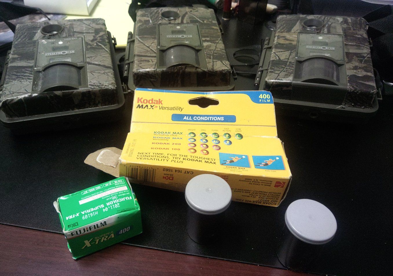 3 Stealth Cams & 3 rolls Kodak MAX Versatility 400 & FujiFilm Superia X-TRA 400 35mm Film Lot - cameras in excellent condition.