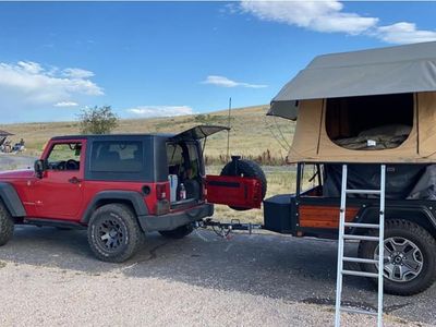 Custom built tent trailer with 2 person ARB roof top tent .