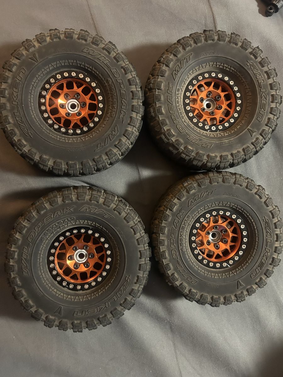 Orange Beadlocks with vanquish tires