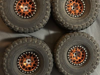 Orange Beadlocks with vanquish tires