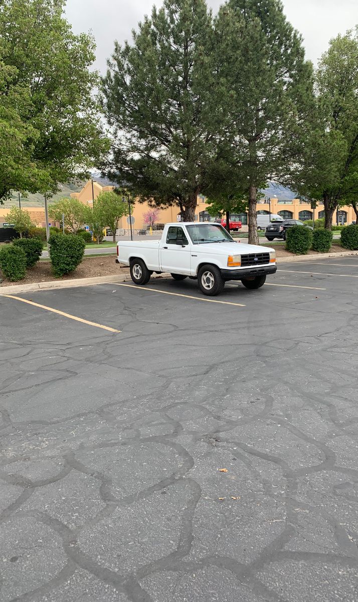 Used White Ford Ranger Pickup Truck, Likely 1990s Model, Runs Well