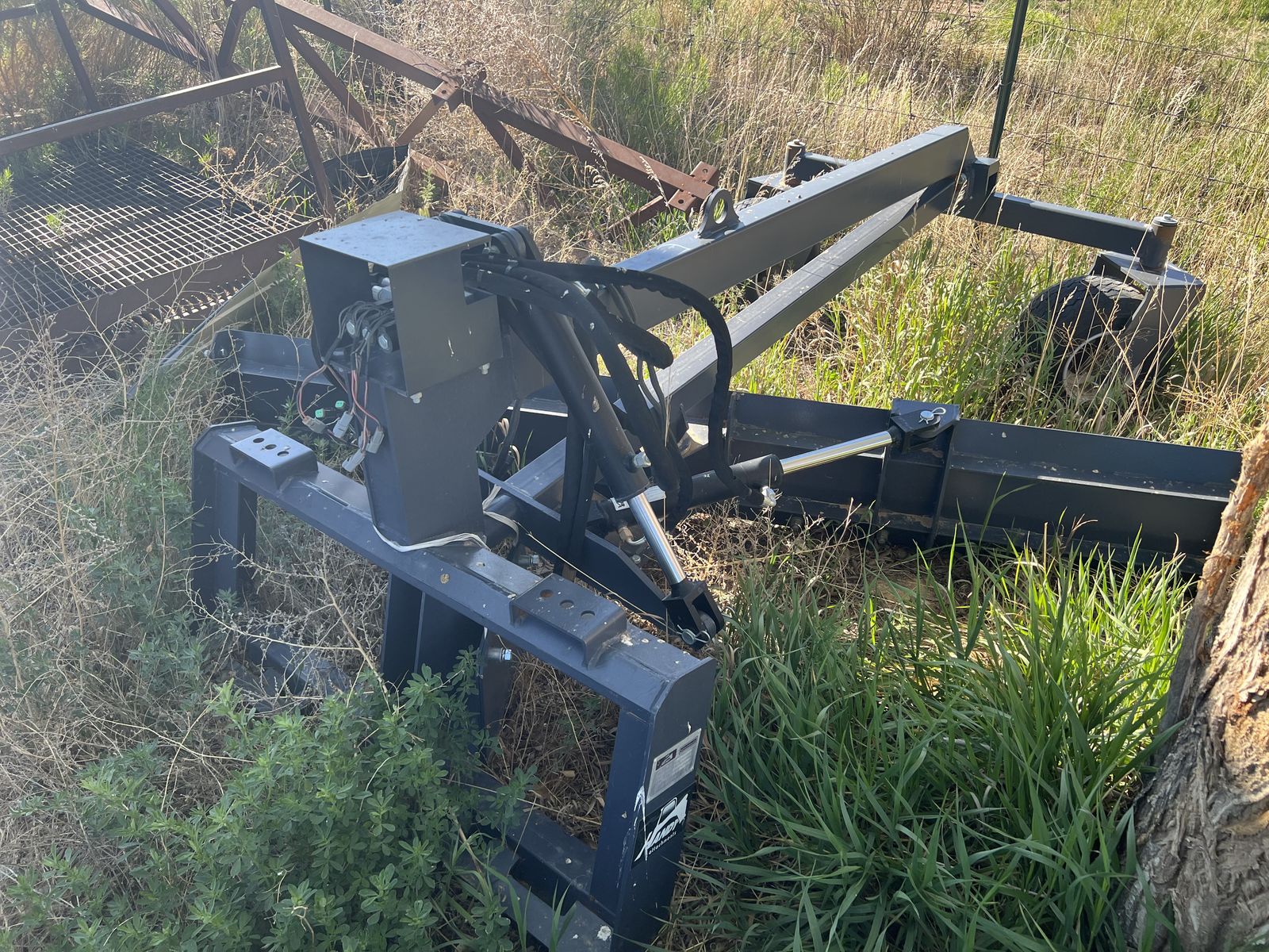 Skid steer grader attachment