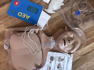 Laerdal Mini Anne CPR Manikin and AED Trainer Kit with Accessories