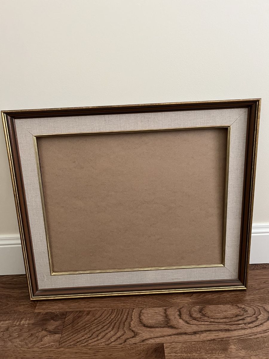 One large solid wood picture frame no glass 3 other smaller frames with glass. All excl condition.