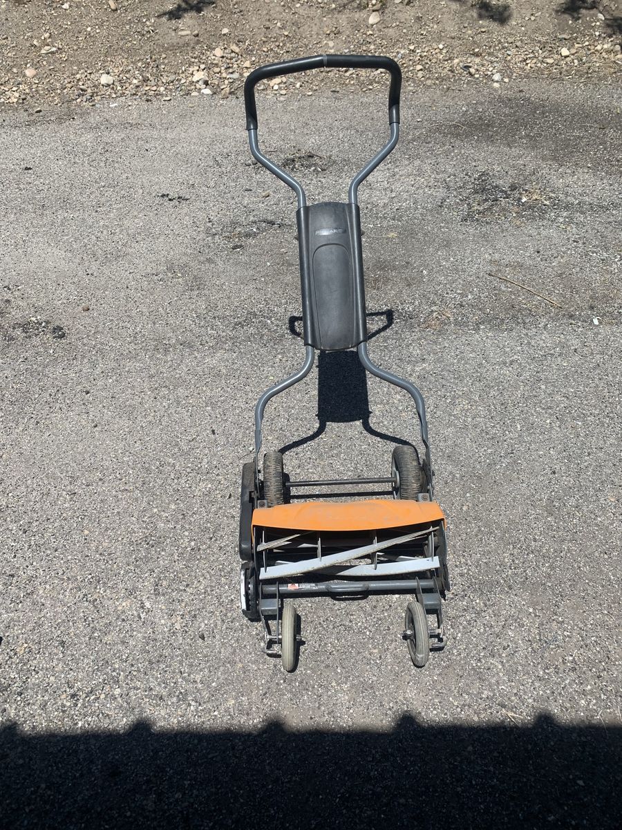 Fiskars reel mower push mower.