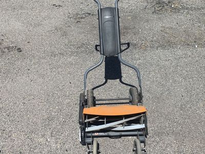 Fiskars reel mower push mower.