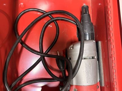 Milwaukee Corded Electric Tool with Red Metal Carrying Case